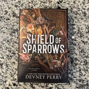 Shield of Sparrows book- limited gold edition with sprayed edges by Devney Perry